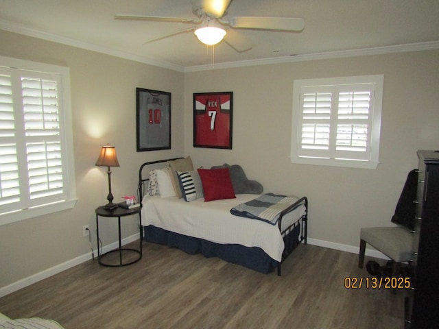 bedroom featuring hardwood / wood-style floors, crown molding, and ceiling fan