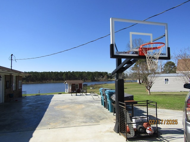 exterior space with a water view and a yard