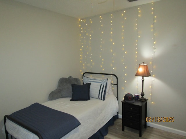 bedroom with wood-type flooring