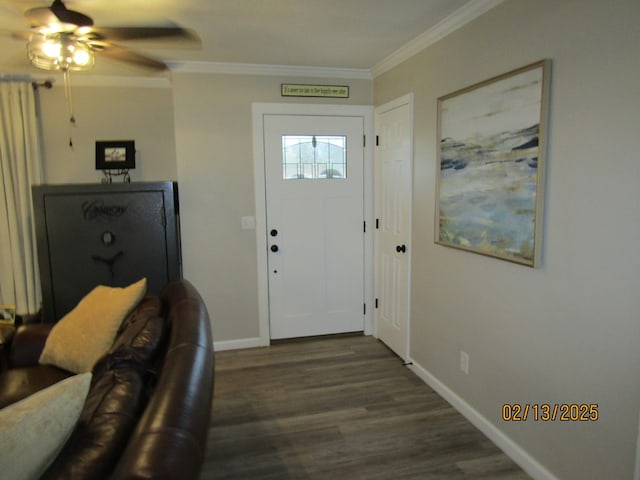 foyer entrance with ceiling fan, ornamental molding, and dark hardwood / wood-style flooring