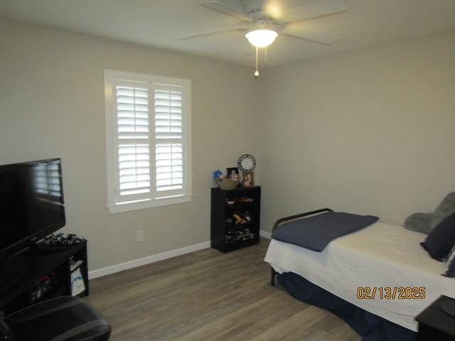 bedroom featuring hardwood / wood-style floors and ceiling fan