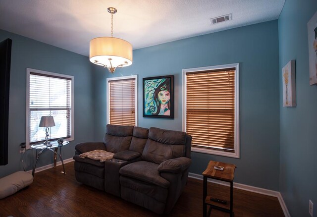 living room with dark hardwood / wood-style floors