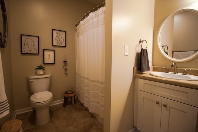 bathroom featuring a shower with curtain, vanity, tile patterned floors, and toilet