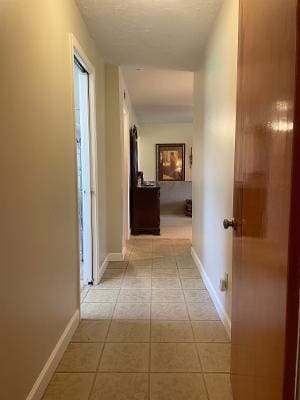 corridor with light tile patterned flooring