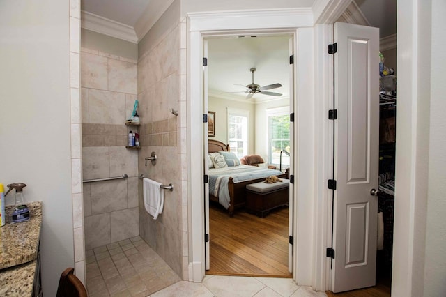 bathroom with a walk in shower, ceiling fan, connected bathroom, and crown molding