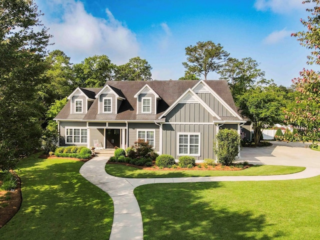 view of front of property featuring board and batten siding and a front lawn