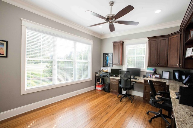 office space featuring crown molding, recessed lighting, ceiling fan, light wood-type flooring, and baseboards