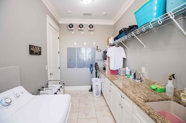 clothes washing area featuring a sink, washer / dryer, light tile patterned floors, and crown molding