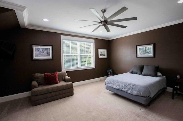 carpeted bedroom featuring a ceiling fan, crown molding, and baseboards