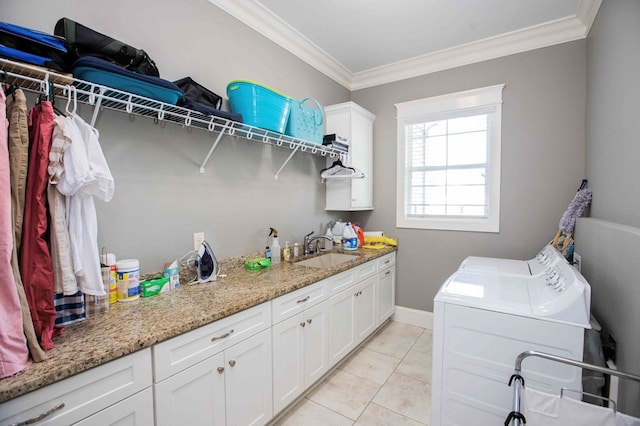 laundry room with washing machine and dryer, ornamental molding, a sink, and light tile patterned flooring