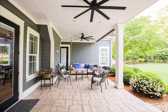 view of patio / terrace with a ceiling fan and an outdoor living space