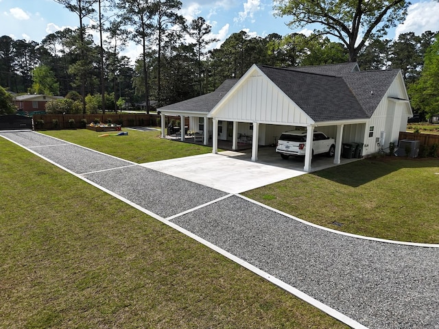 surrounding community featuring fence, an attached carport, driveway, and a yard