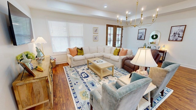 living area featuring baseboards, recessed lighting, wood finished floors, and french doors
