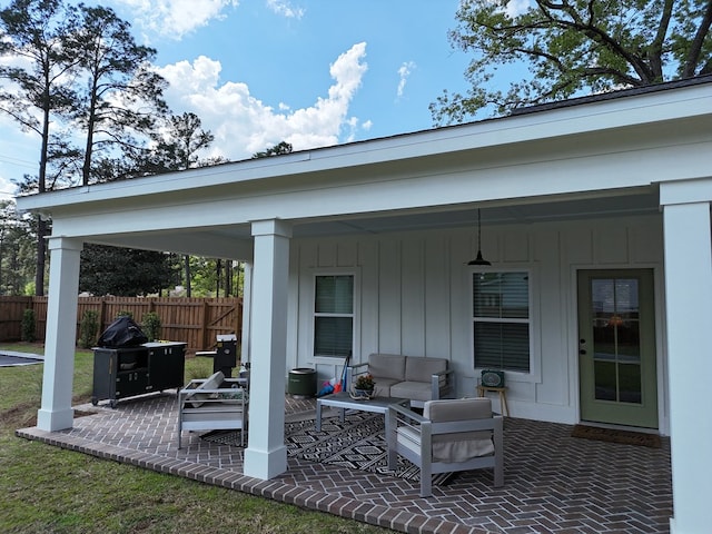 view of patio / terrace featuring outdoor lounge area and fence