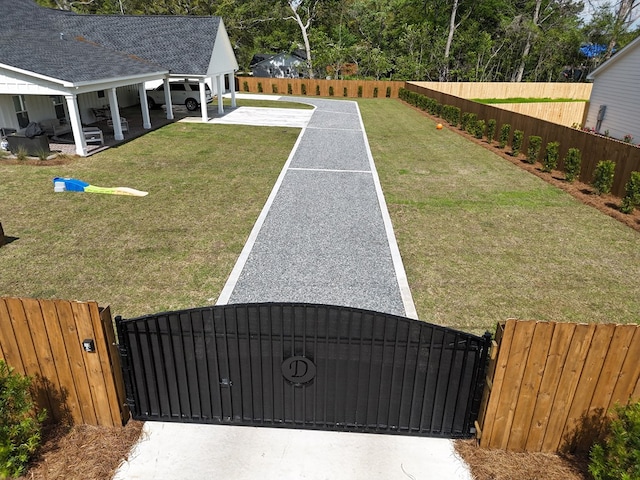 view of yard with a gate, a patio area, and fence private yard
