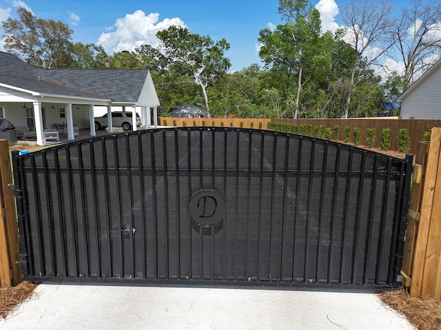 view of gate with fence