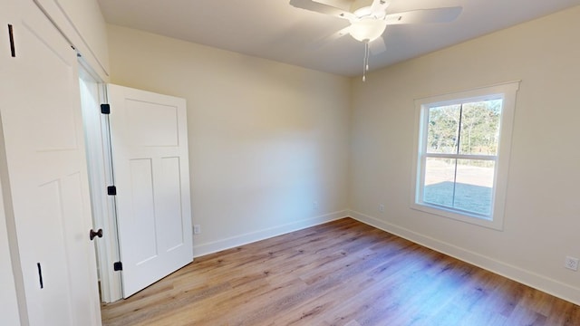 unfurnished room featuring light hardwood / wood-style flooring and ceiling fan