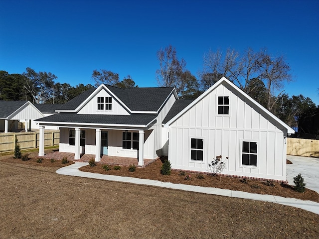 modern farmhouse style home with covered porch