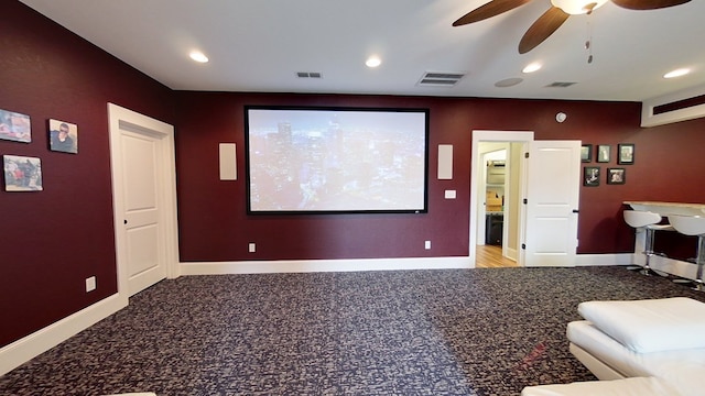 cinema featuring light carpet and ceiling fan