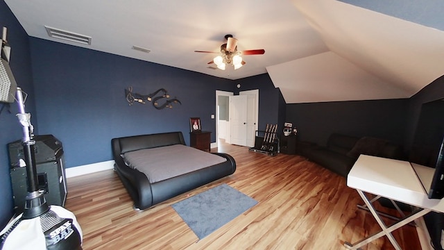 bedroom featuring vaulted ceiling, ceiling fan, and light hardwood / wood-style floors