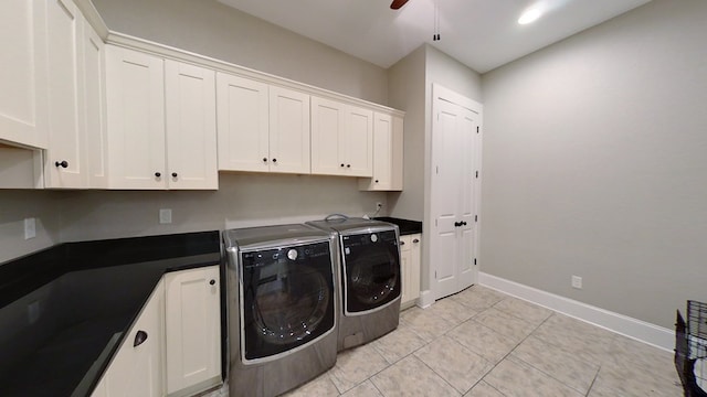 clothes washing area featuring washing machine and dryer, cabinets, and ceiling fan