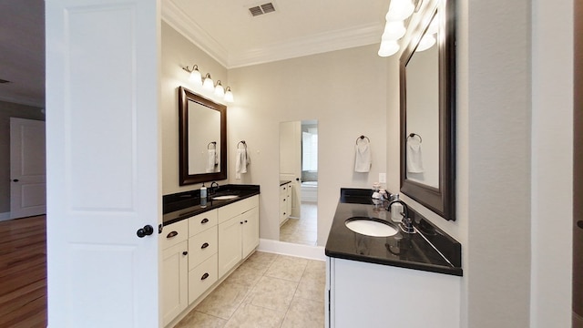 bathroom with ornamental molding, vanity, and tile patterned floors