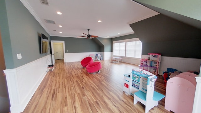 game room with crown molding, ceiling fan, and light hardwood / wood-style flooring