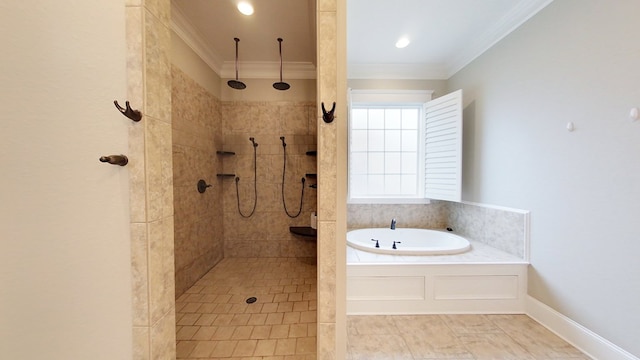 bathroom with ornamental molding and shower with separate bathtub