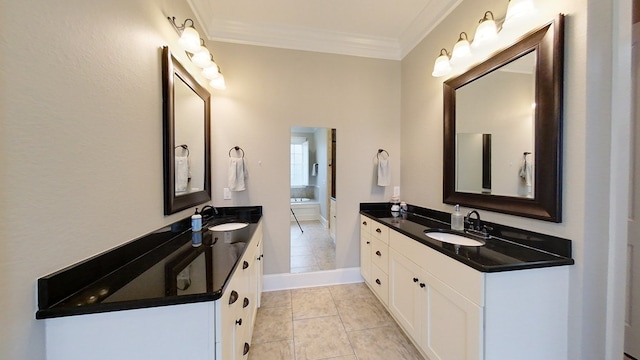 bathroom featuring ornamental molding, tile patterned flooring, and vanity