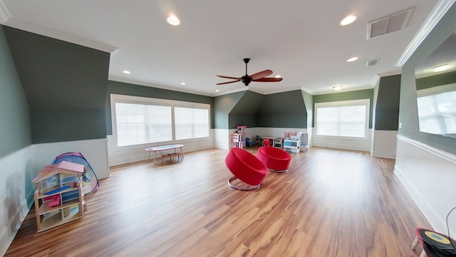 game room with ornamental molding, light hardwood / wood-style floors, and ceiling fan