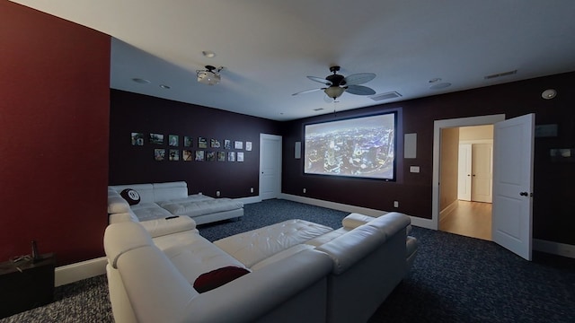 home theater featuring ceiling fan and carpet