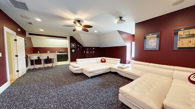 carpeted living room with vaulted ceiling and ceiling fan