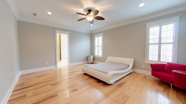 sitting room with crown molding, ceiling fan, and light wood-type flooring