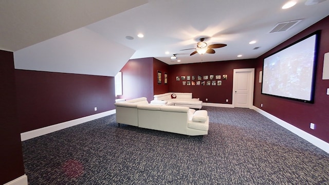 carpeted cinema room with ceiling fan