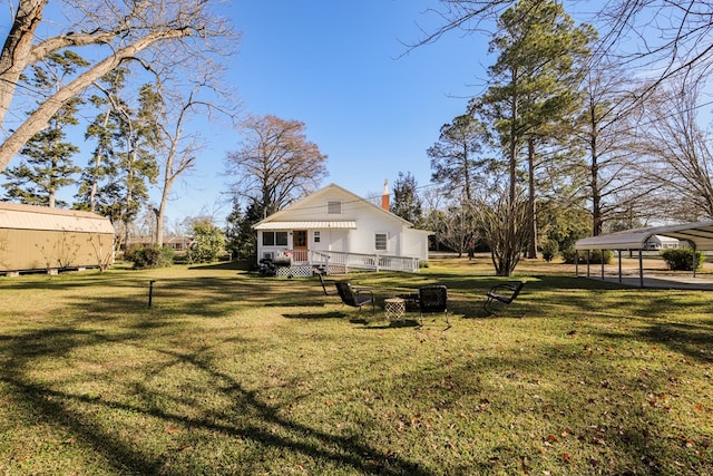 view of yard featuring a detached carport