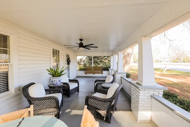 view of patio / terrace with ceiling fan and a porch