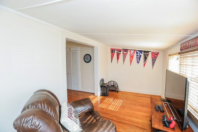 living room featuring baseboards and wood finished floors