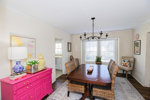 dining area featuring ornamental molding, baseboards, and wood finished floors