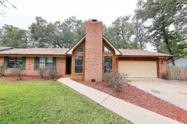 view of front of house featuring a garage and a front lawn