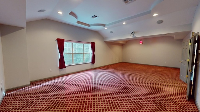 bonus room with lofted ceiling and carpet flooring