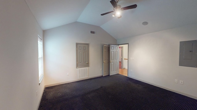 empty room with lofted ceiling, carpet floors, electric panel, and ceiling fan