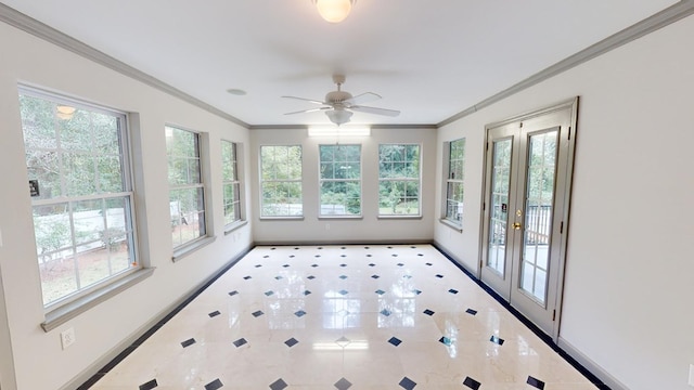 unfurnished sunroom with ceiling fan and french doors