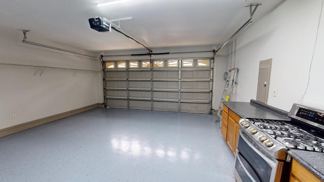 garage with a garage door opener and electric panel