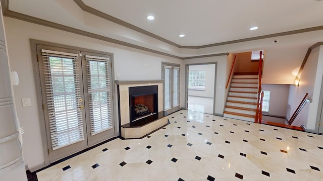 living room featuring crown molding and a wealth of natural light