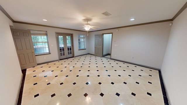 empty room featuring crown molding, a healthy amount of sunlight, ceiling fan, and french doors