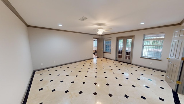 spare room with crown molding, ceiling fan, and french doors