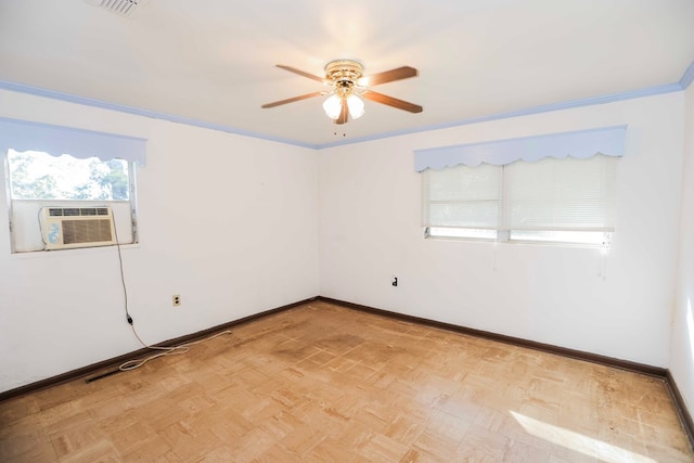 spare room with ornamental molding, light parquet flooring, ceiling fan, and cooling unit