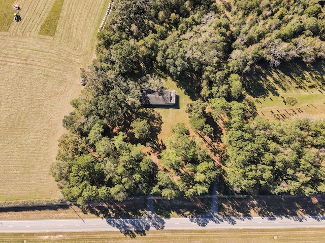 birds eye view of property with a rural view