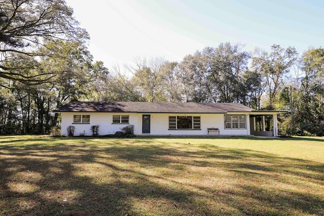 ranch-style home featuring a front yard