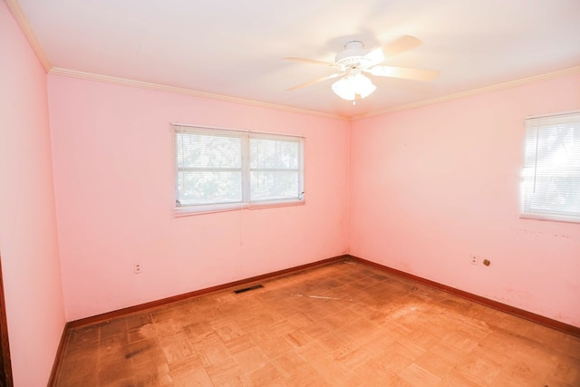 empty room featuring crown molding and ceiling fan